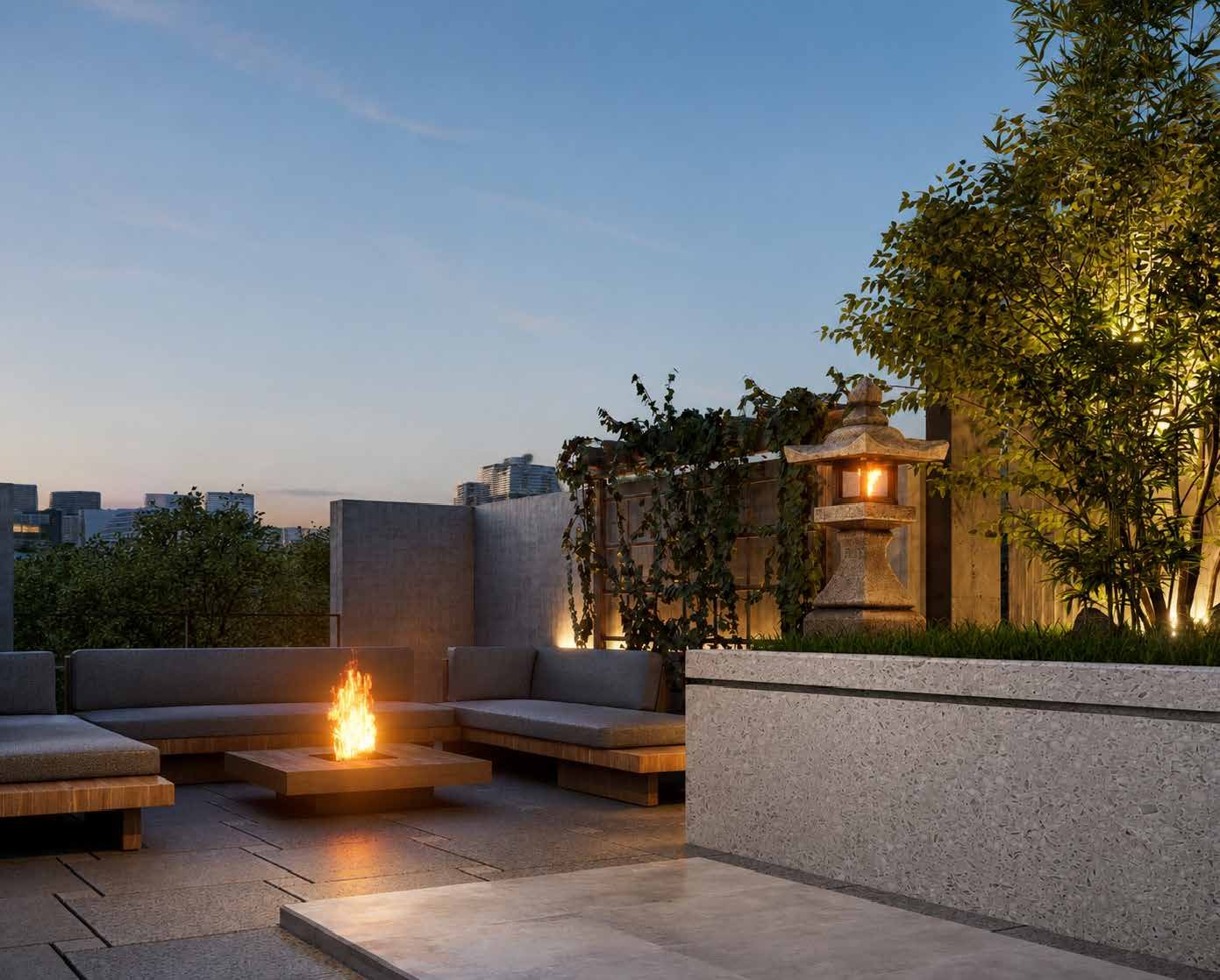 Landscaped rooftop fireplace and lounge seating at Hawa under the evening sky